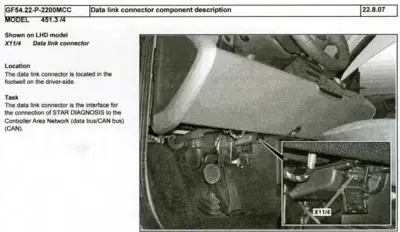 Data link connector mounted in driver footwell, close-up detail view showing connector location.