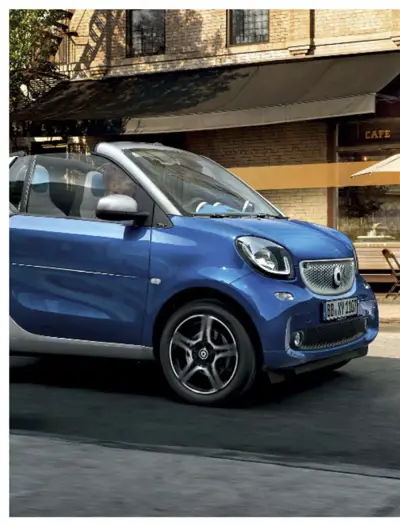 Blue smart fortwo 453 compact car parked outdoors with door open, front three-quarter view.