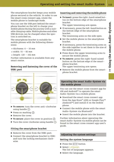 Manual page showing smartphone bracket setup, USB port cover removal steps with numbered callouts, and audio system app instructions.