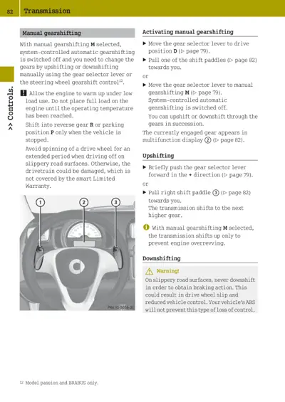 Steering wheel with shift paddles labeled, transmission manual gearshift instructions and warnings
