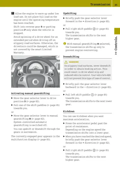 Steering wheel with numbered shift paddles and transmission control instructions for manual gearshifting.