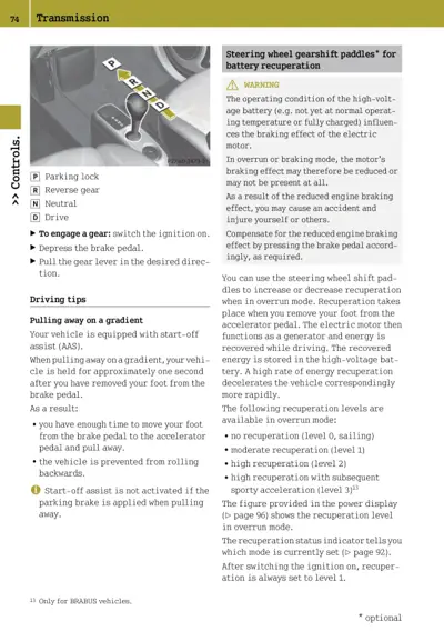 Steering wheel gearshift paddles and transmission lever showing P-R-N-D positions with battery recuperation warning and driving tips.